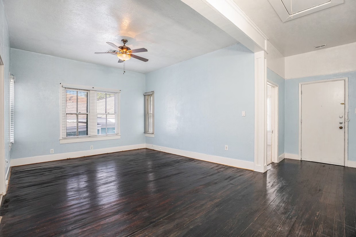 Opened living area after wall removal and header installation