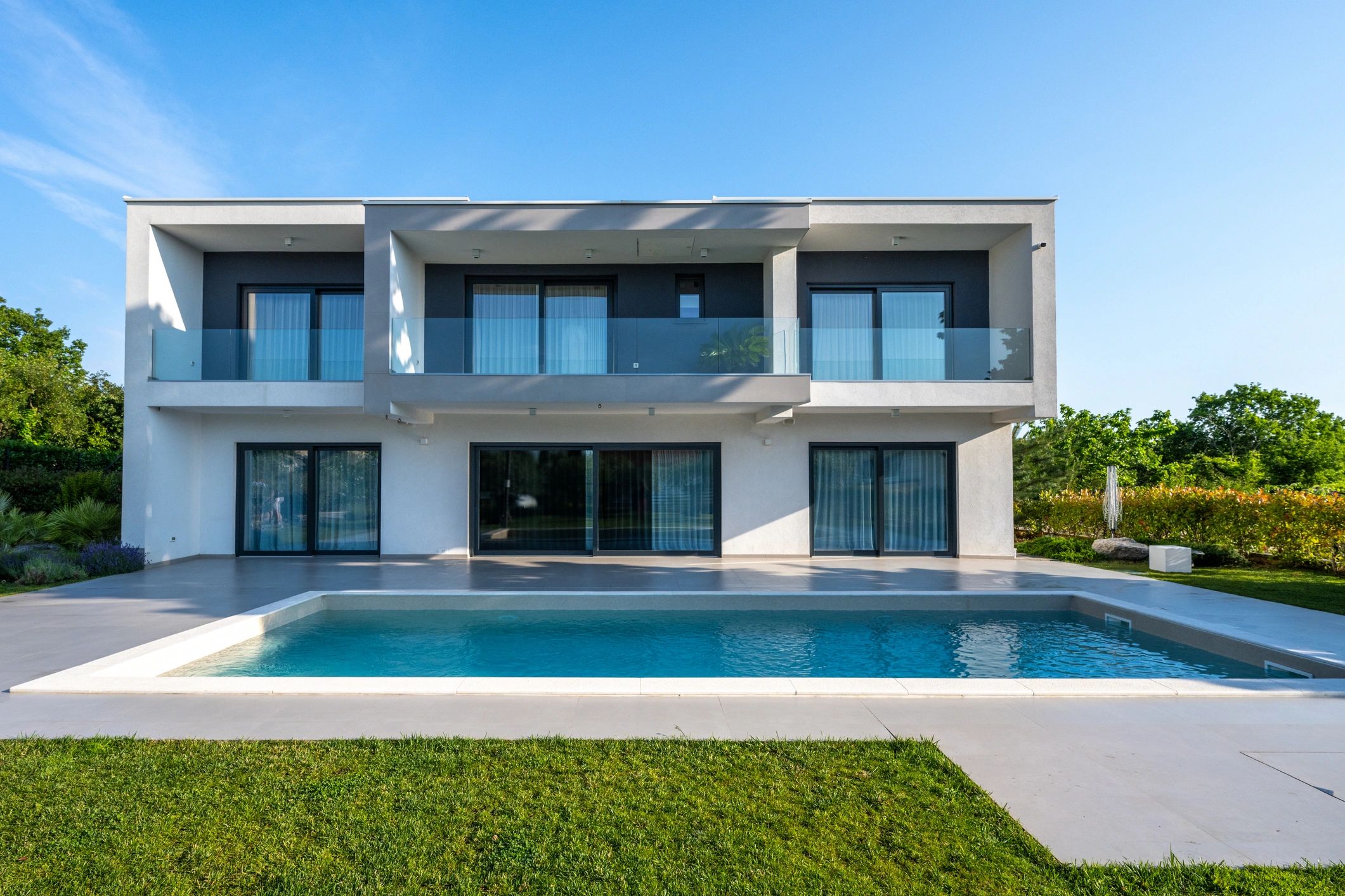 Large luxury home exterior with a warm upscale feel
